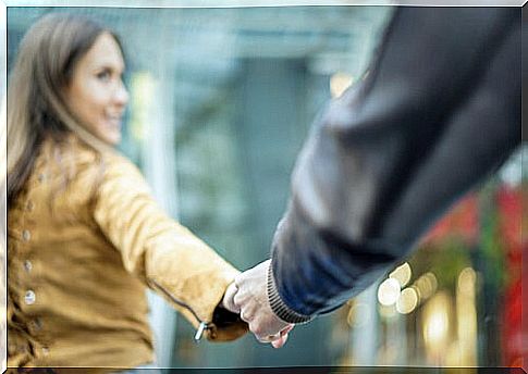 Couple holding hands walking