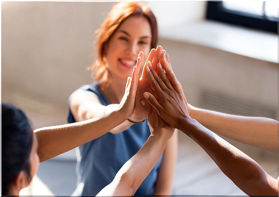 Friends putting hands together