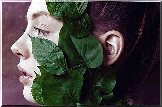 girl with leaves on her face suffering apathy