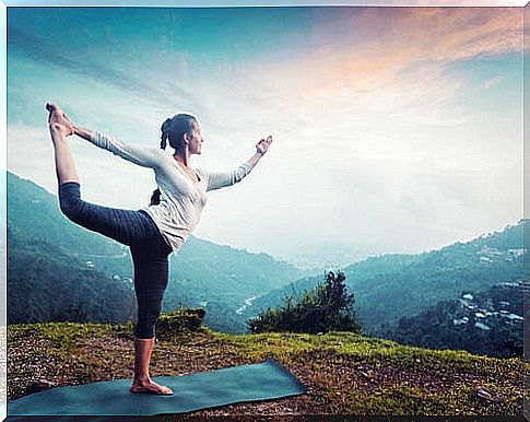 Woman practicing yoga to overcome apathy