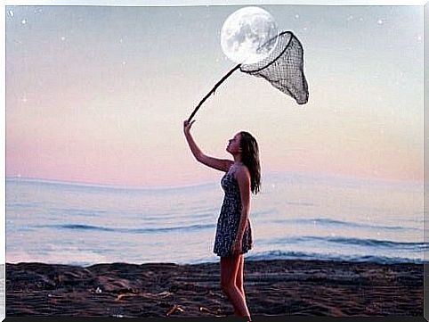 Woman catching the moon