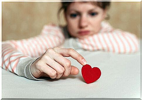 Woman touching a heart