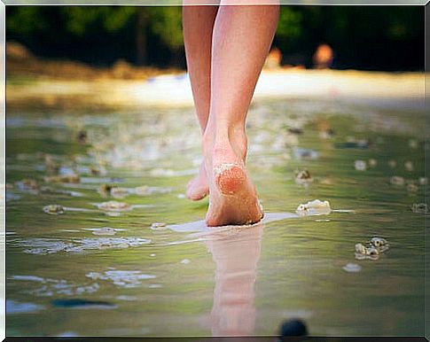 Woman walking on beach