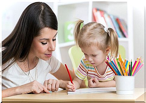 Mother drawing with her daughter