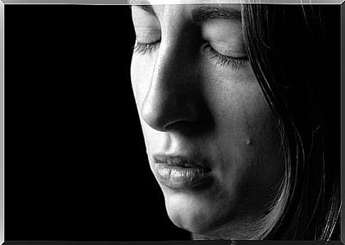 Sad woman with black background