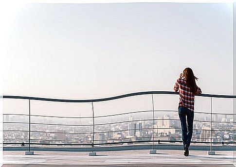 Woman watching the city from high up