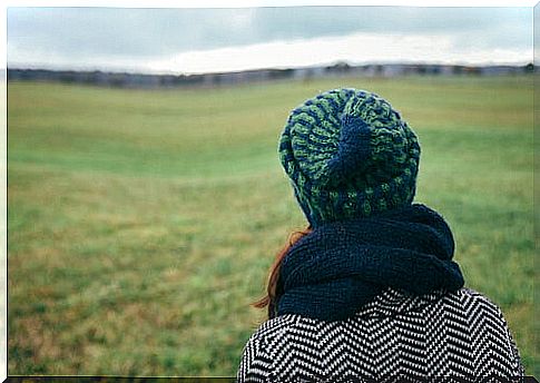 Woman feeling nostalgic for her city or homesickness