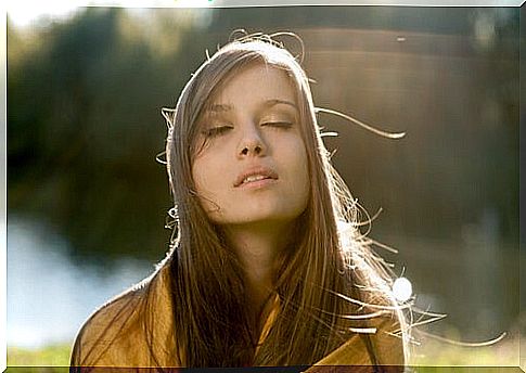 Young woman with eyes closed