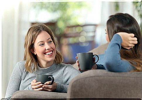 Girlfriends drinking coffee talking