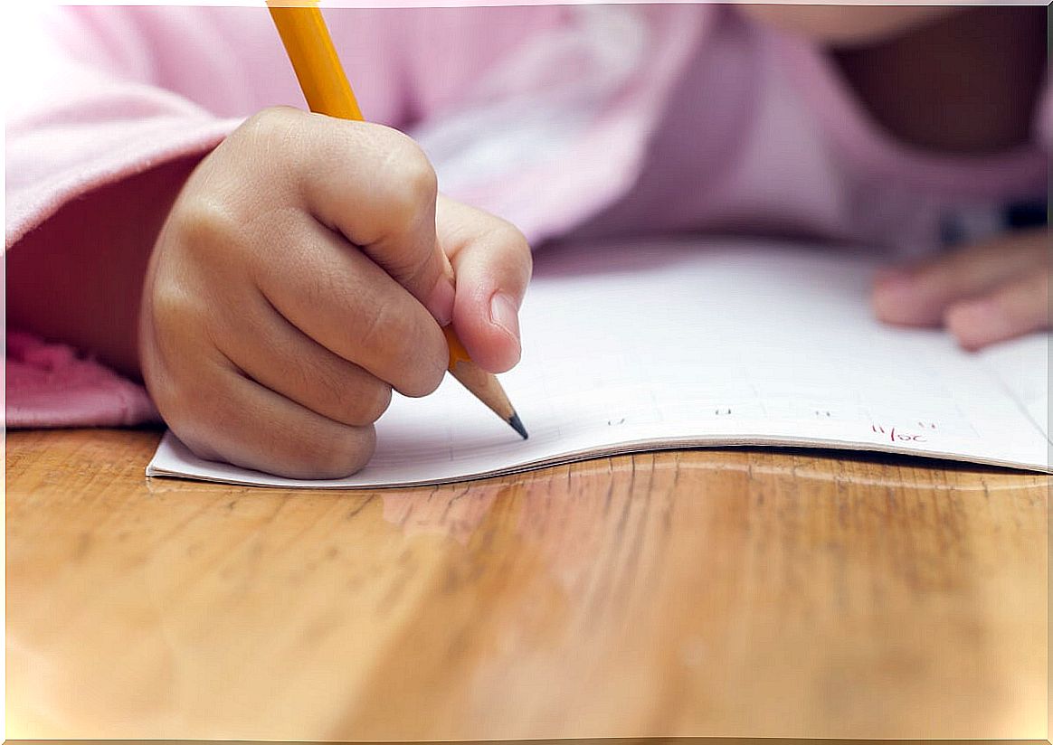 Girl doing writing on mirror