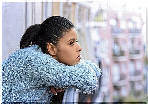 Woman thinking on balcony