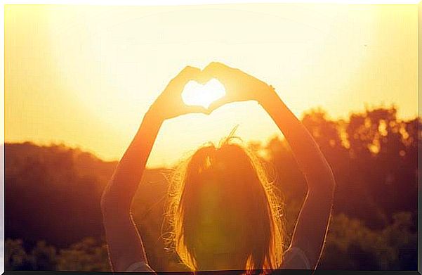 Girl making a heart with her hands