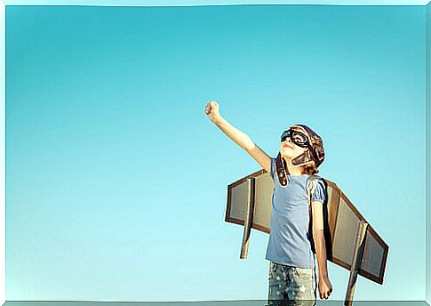 Boy with cardboard plane