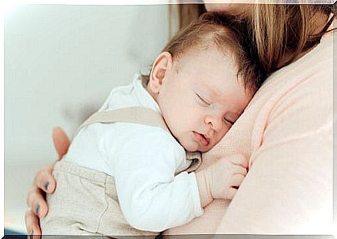 Mother giving caresses to her baby