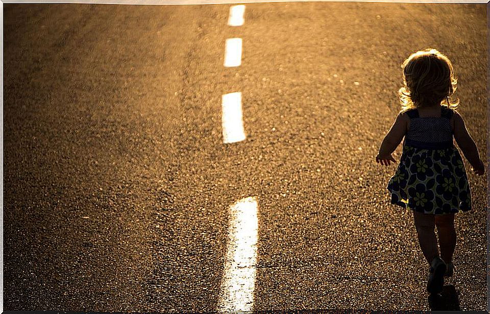 Girl walking down the road